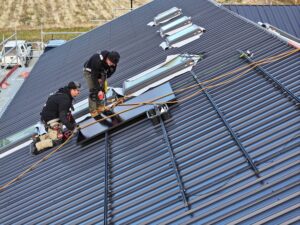 Infinite Energy Team installing panels on roof