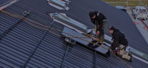 Infinite Energy Team installing panels on roof